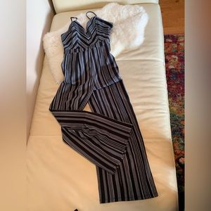 One piece high waisted jumpsuit. Black and white stripes, wide leg. Size large